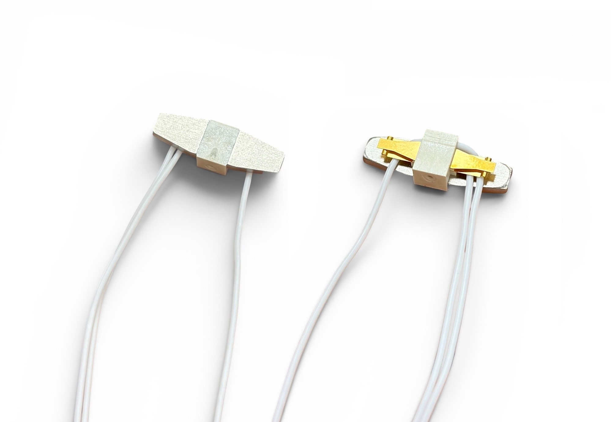 Insert molding and overmolding integrating powder metallurgy inserts, stamping inserts and wires for microwave switch signal routing